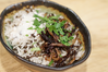 Mujadara: Spiced Rice and Lentils With Crispy Onions and a Milk-Free “Yogurt” Sauce